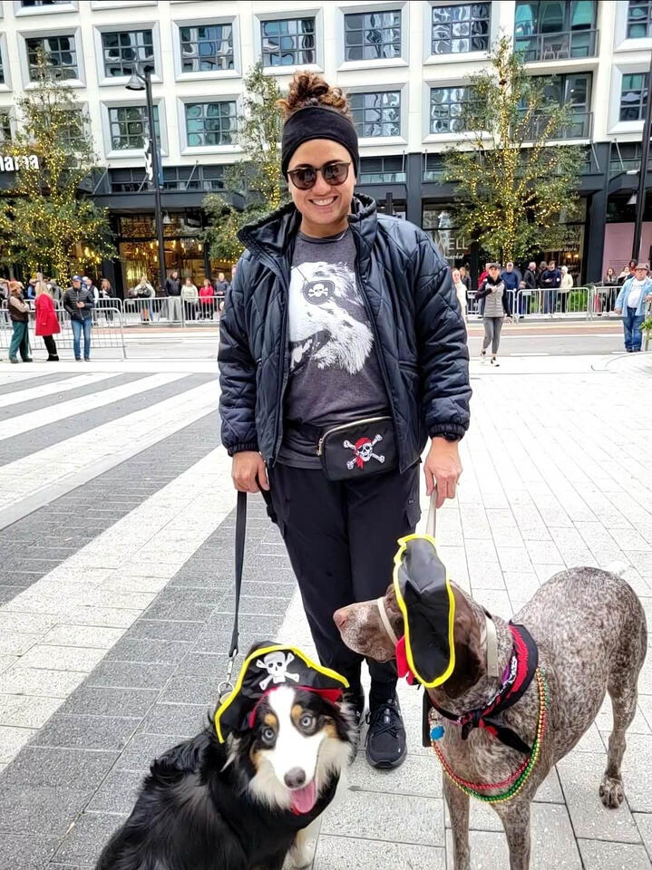 Rosie the German Shorthaired Pointer dressed as a pirate with her sister Tuna and their mom